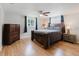 Bedroom with hardwood floors, dresser, and natural light, creating a serene and inviting atmosphere at 5840 Liddell Dr, New Port Richey, FL 34652