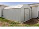 View of shed with light colored siding and dark trim at 5840 Liddell Dr, New Port Richey, FL 34652