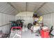 View of the interior of the shed featuring bicycles, lawn equipment, and various storage items at 5840 Liddell Dr, New Port Richey, FL 34652