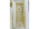 Retro yellow tiled shower with curtain and shower head at 5840 Liddell Dr, New Port Richey, FL 34652