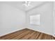 This bedroom features a ceiling fan and a window with wood-look flooring at 5927 10Th N St, St Petersburg, FL 33703