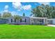 Charming single story home featuring a well-manicured lawn and welcoming front entrance at 5927 10Th N St, St Petersburg, FL 33703