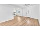 Bright, open living room featuring hardwood floors, a stone fireplace, and modern ceiling fans at 5927 10Th N St, St Petersburg, FL 33703
