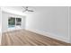 Living room features a sliding glass door that overlooks the pool at 5927 10Th N St, St Petersburg, FL 33703