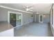 Covered patio with ceiling fans, tile flooring and access to the backyard at 5927 10Th N St, St Petersburg, FL 33703