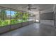 Screened-in patio featuring ceiling fans and a view of the pool and backyard at 5927 10Th N St, St Petersburg, FL 33703