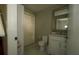 Bathroom with a white vanity, a mirror and white marble floors at 6424 Thicket Trl, New Port Richey, FL 34653