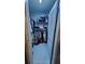 Walk-in closet with ample hanging space and white marble floors at 6424 Thicket Trl, New Port Richey, FL 34653