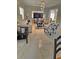 Bright living room with marble floors, modern lighting, and stylish furniture at 6424 Thicket Trl, New Port Richey, FL 34653