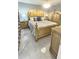 Bedroom featuring marble floors, neutral paint and light-colored wood furniture at 6424 Thicket Trl, New Port Richey, FL 34653