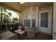 Cozy enclosed patio with neutral furniture, a bay window, and decor at 6424 Thicket Trl, New Port Richey, FL 34653