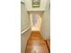 View of wood stairs leading to the lower level of the house at 6424 Thicket Trl, New Port Richey, FL 34653