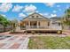 Beautiful view of the back of the home with a lovely wooden deck, perfect for entertaining guests at 6625 Interbay Blvd, Tampa, FL 33611