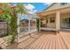 Inviting backyard deck with arbor and blooming flowers, offering a serene outdoor space at 6625 Interbay Blvd, Tampa, FL 33611