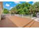 Expansive backyard deck with white railings, ideal for outdoor living and entertaining at 6625 Interbay Blvd, Tampa, FL 33611
