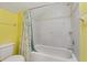 Bright bathroom featuring a shower and bathtub combination, with decorative tile at 6625 Interbay Blvd, Tampa, FL 33611