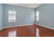 Bedroom featuring laminate floors, neutral paint, and natural light at 6625 Interbay Blvd, Tampa, FL 33611