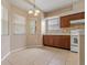Bright breakfast nook featuring tile floors and views of the outdoors through large windows with blinds at 6625 Interbay Blvd, Tampa, FL 33611