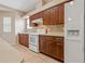Well-equipped kitchen with wooden cabinets, appliances, tile backsplash and plenty of counter space at 6625 Interbay Blvd, Tampa, FL 33611