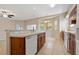 Spacious kitchen with dark wood cabinets, tile flooring, and an open view to the living area at 6625 Interbay Blvd, Tampa, FL 33611