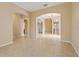 Open-concept living room with tile floors, archways, and ample natural light, ideal for entertaining guests at 6625 Interbay Blvd, Tampa, FL 33611