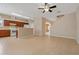 Open living room with tile floors, staircase, and kitchen view, great for entertaining and Gathering gatherings at 6625 Interbay Blvd, Tampa, FL 33611