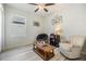Bright bedroom with a reading nook, a light colored walls, and a ceiling fan at 7414 Indigo Oasis Ct, Gibsonton, FL 33534
