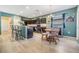 Bright dining area featuring wood table set and modern lighting at 7414 Indigo Oasis Ct, Gibsonton, FL 33534