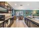 Updated kitchen with breakfast bar that overlooks the dining area at 7414 Indigo Oasis Ct, Gibsonton, FL 33534
