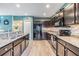 Modern kitchen with granite countertops and stainless steel appliances at 7414 Indigo Oasis Ct, Gibsonton, FL 33534