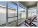 Relaxing screened lanai with outdoor seating and peaceful backyard views at 7414 Indigo Oasis Ct, Gibsonton, FL 33534