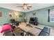Cozy living room featuring a ceiling fan, decorative art, and comfortable seating at 7414 Indigo Oasis Ct, Gibsonton, FL 33534