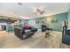 Open living room with modern furniture, neutral floors, and stylish decorations at 7414 Indigo Oasis Ct, Gibsonton, FL 33534