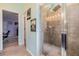 Modern bathroom shower featuring tiled walls and glass enclosure at 7414 Indigo Oasis Ct, Gibsonton, FL 33534