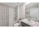 Bathroom featuring a shower-tub combination, vanity with sink, and neutral decor at 7641 Sail Clover Ln, Zephyrhills, FL 33540