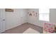 Charming Bedroom room with crib and decorative accents at 7641 Sail Clover Ln, Zephyrhills, FL 33540