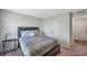 Cozy bedroom featuring a comfortable bed, soft lighting, and ample closet space at 7641 Sail Clover Ln, Zephyrhills, FL 33540