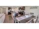 Eat-in kitchen features stainless steel appliances, granite countertops, and dark wood cabinetry at 7641 Sail Clover Ln, Zephyrhills, FL 33540