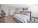 Comfortable main bedroom with a queen-sized bed, and simple decor at 7641 Sail Clover Ln, Zephyrhills, FL 33540