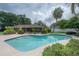 The backyard features an inviting swimming pool and an enclosed patio area at 7902 Heather Ct, Tampa, FL 33634