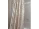 Tiled bathroom showcasing a neutral shower curtain at 7902 Heather Ct, Tampa, FL 33634