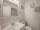 Well-lit bathroom with a clean vanity and decorative accents at 7902 Heather Ct, Tampa, FL 33634