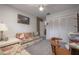 Bedroom featuring a floral sofa bed, neutral carpet, and ample closet space at 7902 Heather Ct, Tampa, FL 33634