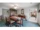 Elegant dining room with classic furniture, chandelier, and a view into the living area at 7902 Heather Ct, Tampa, FL 33634