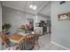 Eat-in kitchen with white tile floors and view into the kitchen at 7902 Heather Ct, Tampa, FL 33634