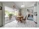 Eat-in kitchen with tile floors and view to screened-in patio at 7902 Heather Ct, Tampa, FL 33634