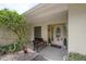 Charming covered entry with bench seating and attractive landscaping, creating a welcoming approach at 7902 Heather Ct, Tampa, FL 33634