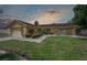 Charming single-story home with a well-manicured lawn and lush landscaping featuring a sprinkler system at 7902 Heather Ct, Tampa, FL 33634