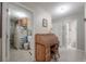 Functional hallway connecting the kitchen and bathroom with a practical desk at 7902 Heather Ct, Tampa, FL 33634