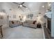 Cozy living room with vaulted ceilings, neutral walls, plush carpet and comfortable seating at 7902 Heather Ct, Tampa, FL 33634